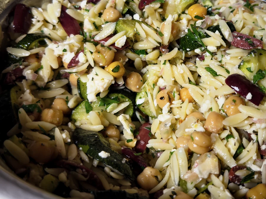 Lemon-herb orzo salad with zucchini, chickpeas, olives, feta, and fresh herbs